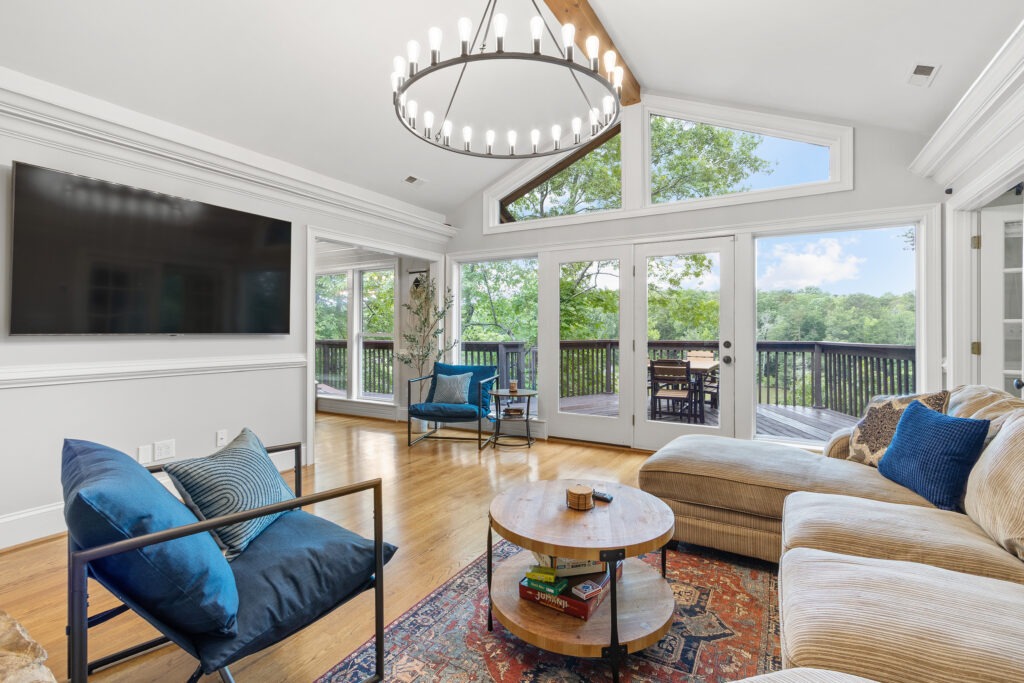 GLOW home showing living room with large windows.